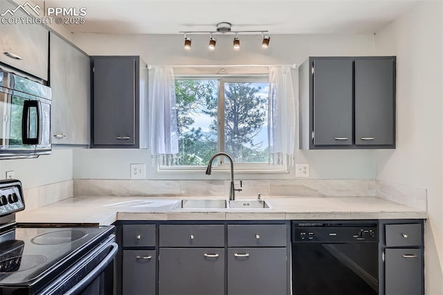 1994 Erin Loop, Colorado Springs, CO 80918 - kitchen with black appliances, gray cabinets, light countertops, and rail lighting