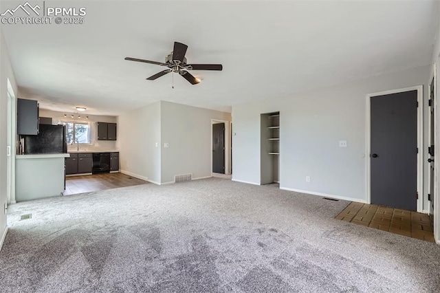 1994 Erin Loop, Colorado Springs, CO 80918 - unfurnished living room featuring carpet floors, ceiling fan, and wine cooler