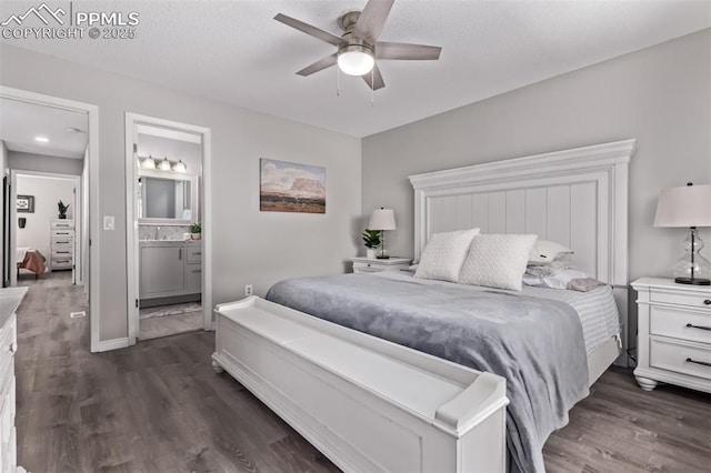 12183 W Chenango Dr, Morrison, CO 80465 - bedroom featuring dark wood-style flooring, ensuite bathroom, and a ceiling fan