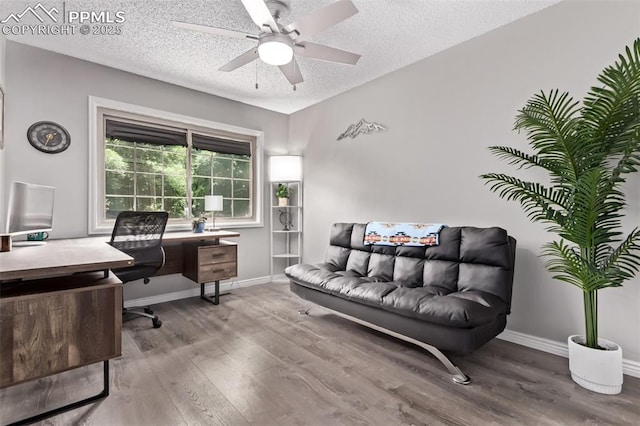 12183 W Chenango Dr, Morrison, CO 80465 - home office with wood finished floors, ceiling fan, and a textured ceiling