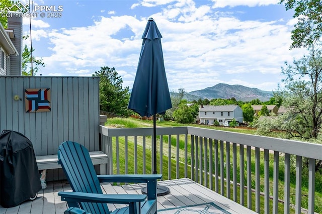 12183 W Chenango Dr, Morrison, CO 80465 - deck with a mountain view, a yard, and area for grilling