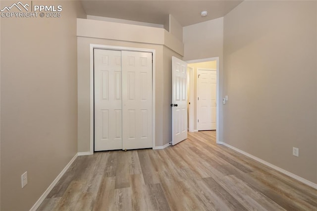 6872 Los Reyes Cir, Colorado Springs, CO 80918 - unfurnished bedroom featuring light wood-type flooring and a closet
