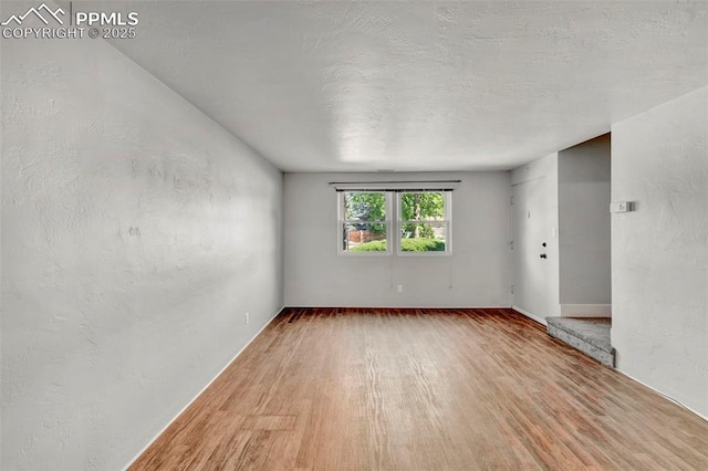 2493 Paseo Rd, Colorado Springs, CO 80907 - unfurnished room with wood finished floors