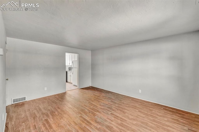 2493 Paseo Rd, Colorado Springs, CO 80907 - empty room with light wood-style flooring