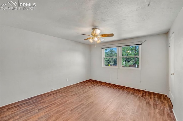 2493 Paseo Rd, Colorado Springs, CO 80907 - unfurnished room with wood finished floors and ceiling fan