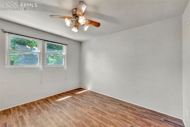 2493 Paseo Rd, Colorado Springs, CO 80907 - unfurnished room featuring wood finished floors and ceiling fan