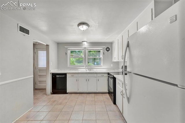 2493 Paseo Rd, Colorado Springs, CO 80907 - kitchen featuring black appliances, light countertops, white cabinetry, and light tile patterned floors