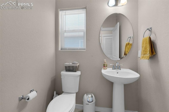 2823 Gobi Dr, Colorado Springs, CO 80939 - half bath featuring toilet and a sink