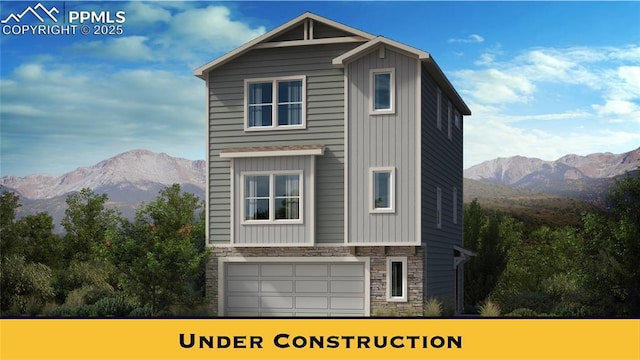 7351 Cornice Pt, Colorado Springs, CO 80923 - view of front of home with stone siding, a mountain view, a garage, and board and batten siding