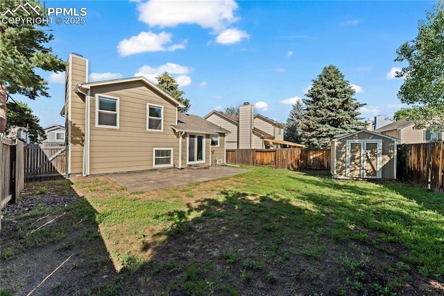 5360 Tupper Ct, Colorado Springs, CO 80923 - back of property featuring a patio area, a fenced backyard, a storage unit, and a chimney