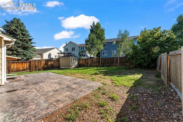 5360 Tupper Ct, Colorado Springs, CO 80923 - fenced backyard featuring a patio area, a shed, and a residential view