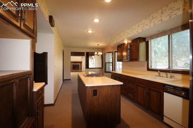 4170 Broadmoor Bluffs Dr, Colorado Springs, CO 80906 - kitchen featuring dishwasher, light countertops, a center island, recessed lighting, and stainless steel gas cooktop