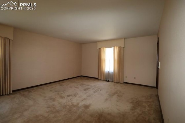 4170 Broadmoor Bluffs Dr, Colorado Springs, CO 80906 - spare room with light colored carpet and baseboards