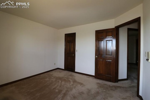 4170 Broadmoor Bluffs Dr, Colorado Springs, CO 80906 - unfurnished bedroom featuring carpet and baseboards