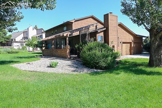 4170 Broadmoor Bluffs Dr, Colorado Springs, CO 80906 - back of house featuring a lawn, a chimney, and a garage