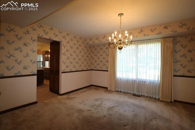 4170 Broadmoor Bluffs Dr, Colorado Springs, CO 80906 - carpeted spare room with wallpapered walls and a chandelier