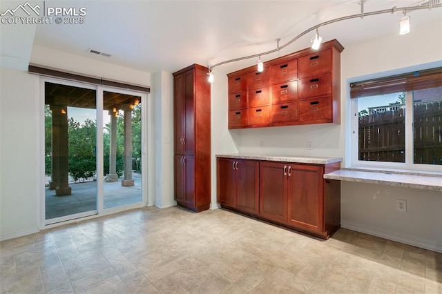 10489 Cedar Breaks Dr, Peyton, CO 80831 - kitchen with light countertops and plenty of natural light