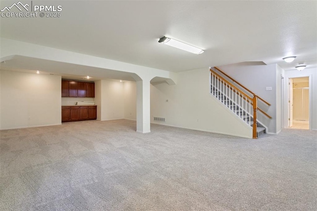 10489 Cedar Breaks Dr, Peyton, CO 80831 - finished basement with light colored carpet and stairway