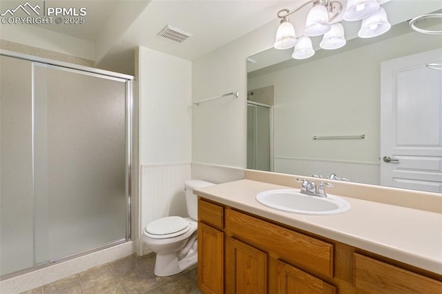 10489 Cedar Breaks Dr, Peyton, CO 80831 - full bath featuring a chandelier, vanity, a stall shower, and wainscoting