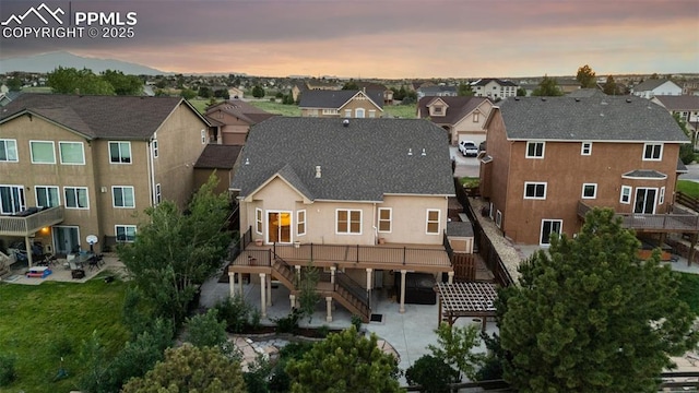 10489 Cedar Breaks Dr, Peyton, CO 80831 - back of property with stairway, a patio area, and a residential view