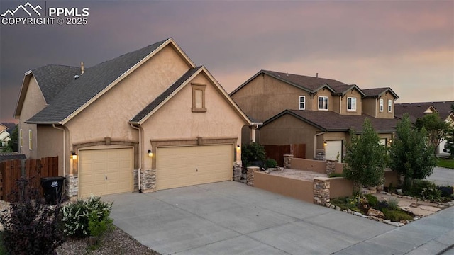 10489 Cedar Breaks Dr, Peyton, CO 80831 - traditional-style home featuring driveway, stucco siding, stone siding, and an attached garage
