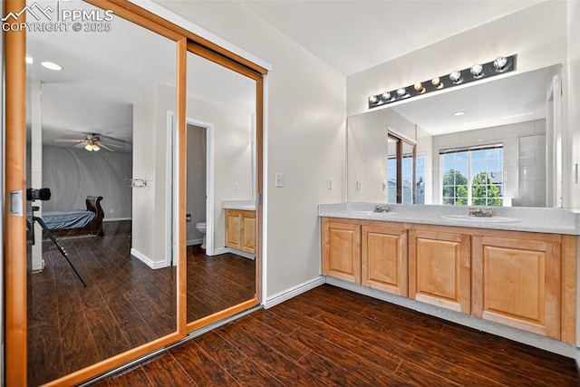 3035 Cascade Falls Pt, Colorado Springs, CO 80922 - full bathroom with wood finished floors, double vanity, and a ceiling fan