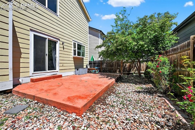3035 Cascade Falls Pt, Colorado Springs, CO 80922 - wooden deck with a patio and a fenced backyard