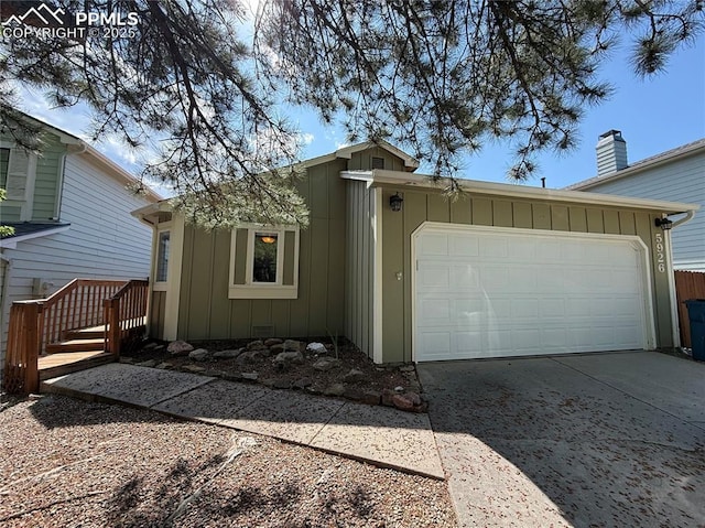 5926 Wisteria Dr, Colorado Springs, CO 80919 - garage featuring driveway