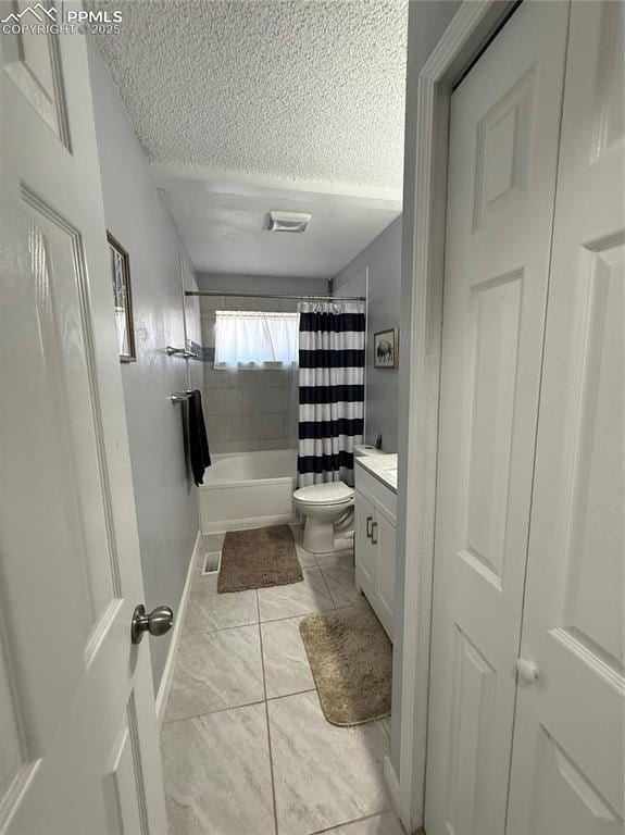 5926 Wisteria Dr, Colorado Springs, CO 80919 - bathroom with a textured ceiling, vanity, shower / bath combination with curtain, and tile patterned floors