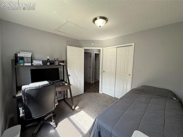 5926 Wisteria Dr, Colorado Springs, CO 80919 - bedroom featuring attic access, carpet, a desk, a closet, and a textured ceiling