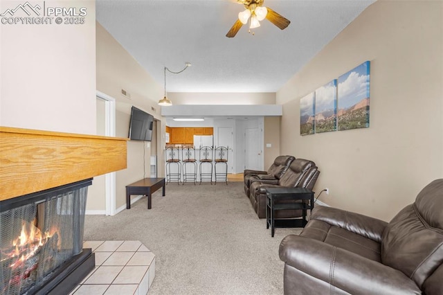 3692 Iguana Dr, Colorado Springs, CO 80910 - living area with a ceiling fan, carpet floors, and a multi sided fireplace