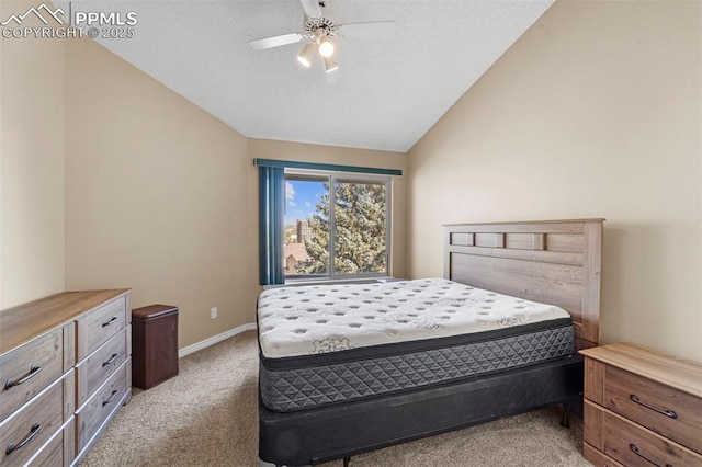 3692 Iguana Dr, Colorado Springs, CO 80910 - bedroom featuring light colored carpet, vaulted ceiling, a textured ceiling, and a ceiling fan