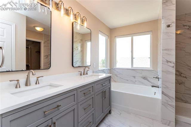 7292 Gardenstone Dr, Colorado Springs, CO 80922 - bathroom with marble finish floors, a garden tub, double vanity, and a marble finish shower