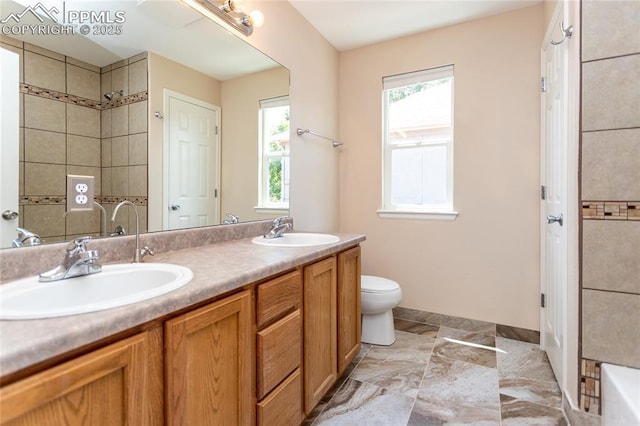 7292 Gardenstone Dr, Colorado Springs, CO 80922 - full bathroom with double vanity, a shower, and a bathtub