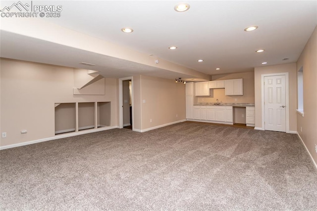 7292 Gardenstone Dr, Colorado Springs, CO 80922 - unfurnished living room featuring carpet and recessed lighting
