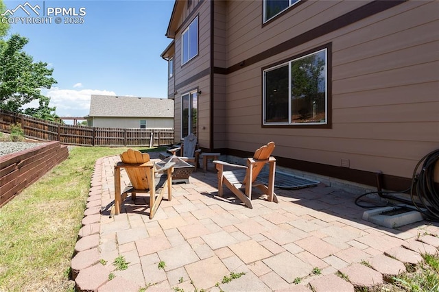 7292 Gardenstone Dr, Colorado Springs, CO 80922 - view of patio / terrace featuring an outdoor fire pit