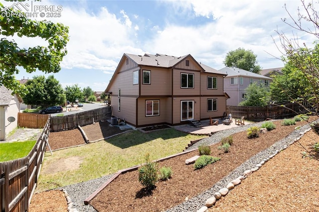7292 Gardenstone Dr, Colorado Springs, CO 80922 - back of property featuring a patio area, a fenced backyard, and board and batten siding