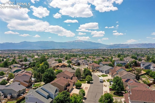 7292 Gardenstone Dr, Colorado Springs, CO 80922 - aerial perspective of suburban area with a mountainous background