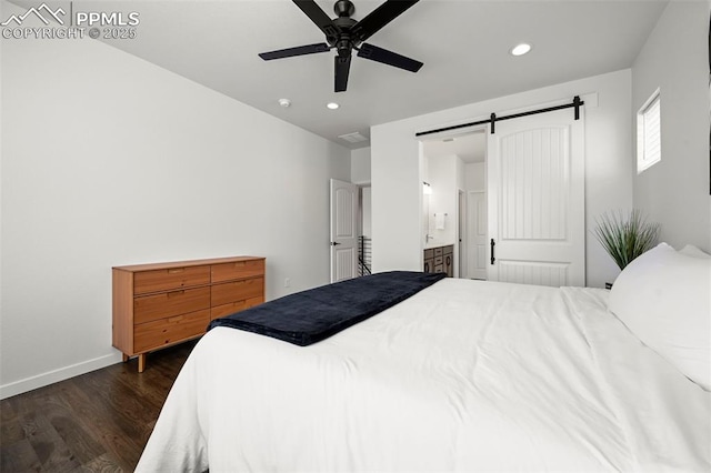 8309 Tom Ketchum Dr, Colorado Springs, CO 80908 - bedroom featuring dark wood-style flooring, a barn door, recessed lighting, ensuite bathroom, and ceiling fan