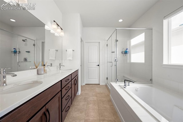 8309 Tom Ketchum Dr, Colorado Springs, CO 80908 - full bath with a shower stall, double vanity, a garden tub, tile patterned flooring, and recessed lighting