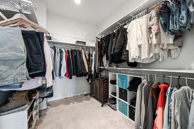 8309 Tom Ketchum Dr, Colorado Springs, CO 80908 - spacious closet with tile patterned flooring