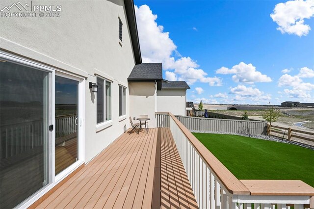 8309 Tom Ketchum Dr, Colorado Springs, CO 80908 - wooden deck featuring a fenced backyard