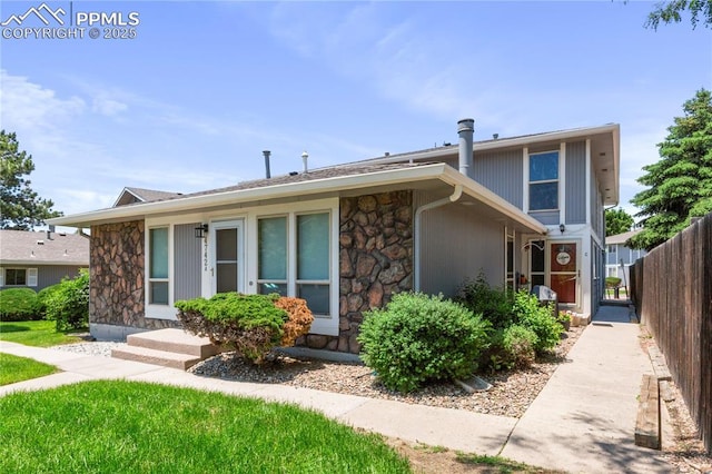 4742 Villa Cir Unit A, Colorado Springs, CO 80918 - view of front of house with stone siding