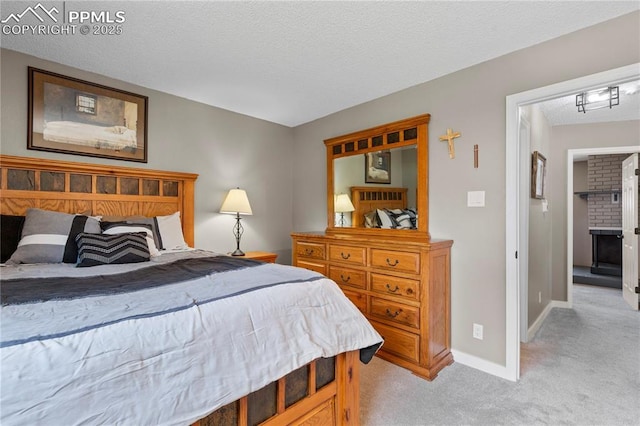 4742 Villa Cir Unit A, Colorado Springs, CO 80918 - bedroom featuring light carpet and a textured ceiling