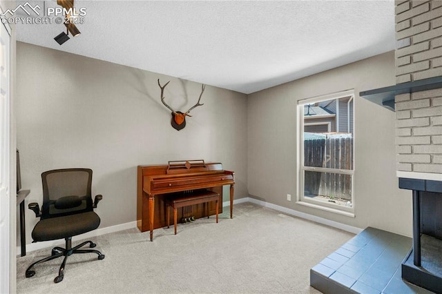 4742 Villa Cir Unit A, Colorado Springs, CO 80918 - living area with a multi sided fireplace, carpet flooring, and a textured ceiling