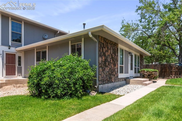 4742 Villa Cir Unit A, Colorado Springs, CO 80918 - view of side of property with stone siding
