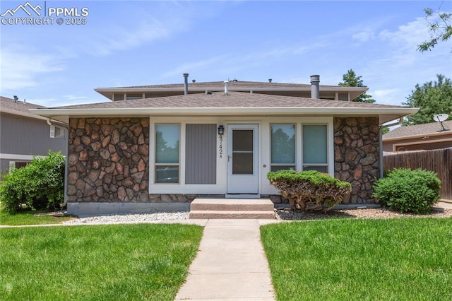 4742 Villa Cir Unit A, Colorado Springs, CO 80918 - view of front of home featuring stone siding and roof with shingles