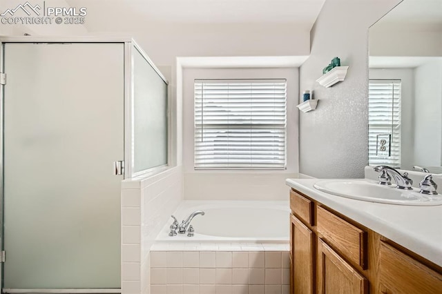 5480 Flag Way, Colorado Springs, CO 80919 - bathroom with vanity, a shower stall, and a garden tub