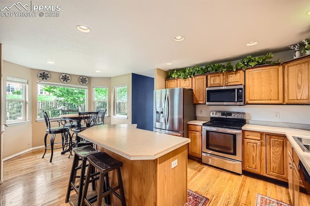 5480 Flag Way, Colorado Springs, CO 80919 - kitchen featuring stainless steel appliances, light countertops, light wood-style flooring, and recessed lighting