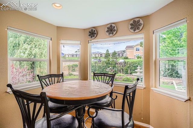 5480 Flag Way, Colorado Springs, CO 80919 - dining space featuring plenty of natural light and a textured wall